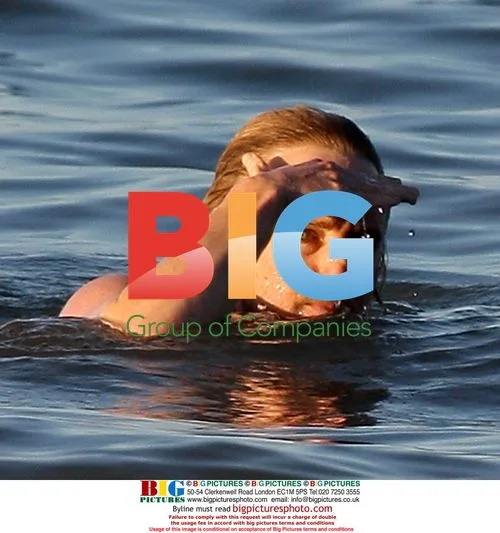 Owen Wilson and Woody Harrelson swim in Maui