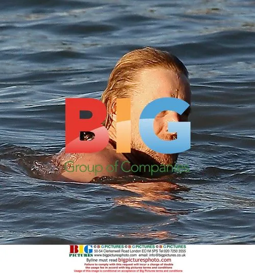 Owen Wilson and Woody Harrelson swim in Maui