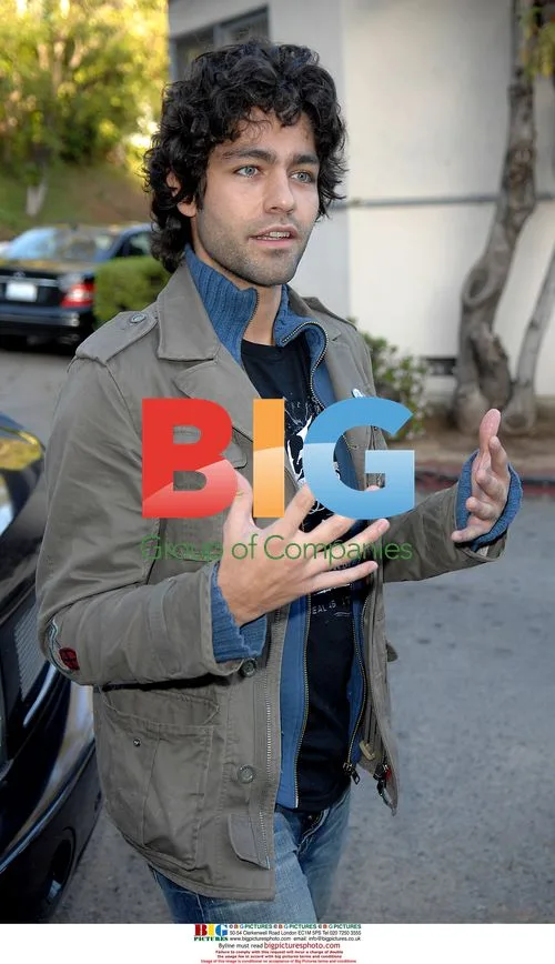 Adrien Grenier plays with kitty