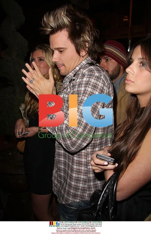 Sean Stewart waits to enter club with girlfriends