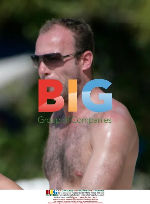 Ex-Footballer Alan Shearer Vacations in Caribbean