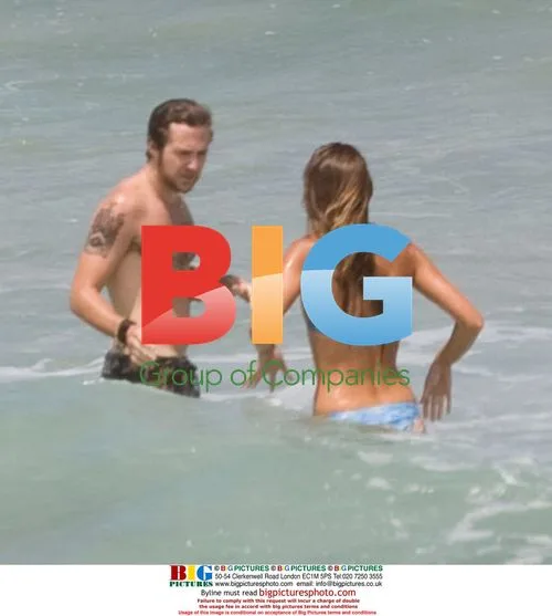 Sharni Vinson and AJ Buckley on Sydney beach