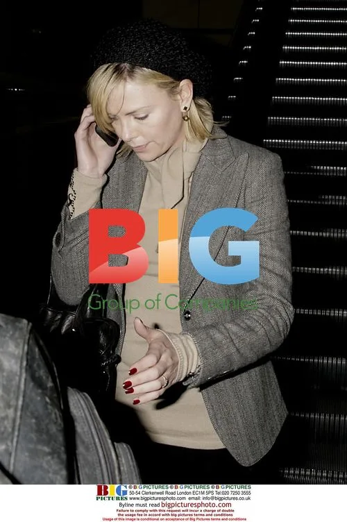 Charlize Theron and Stuart Townsend Arrive at LAX