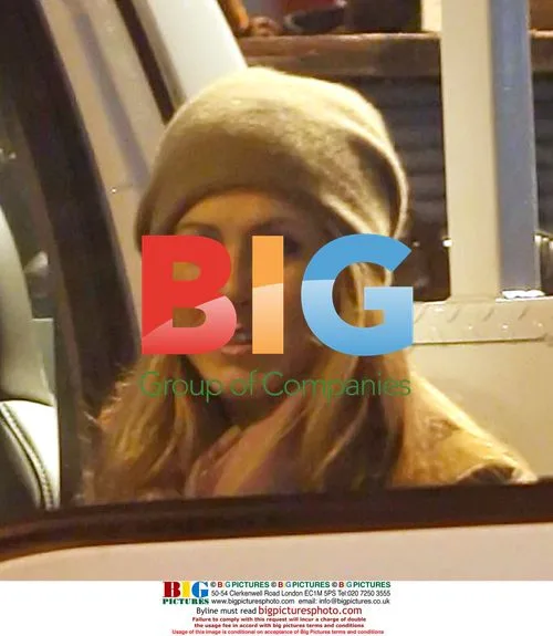 Jennifer Aniston and mystery hunk on Traveling set