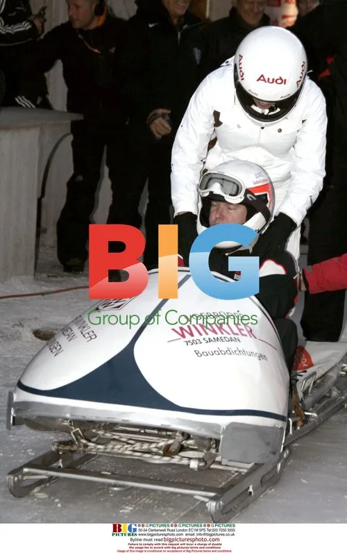 Prince Albert II and Charlene Wittstock Bobsleighing in St. Moritz