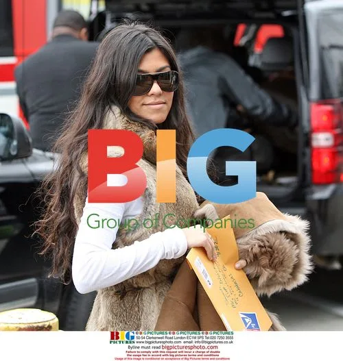 The Kardashians Arrive at LAX in Fur and Boots