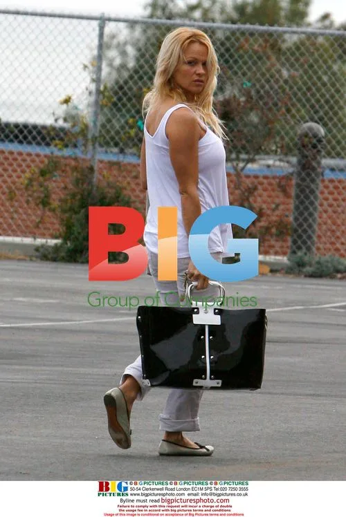 Pamela Anderson and Son Brandon Lee Attend Basketball Game