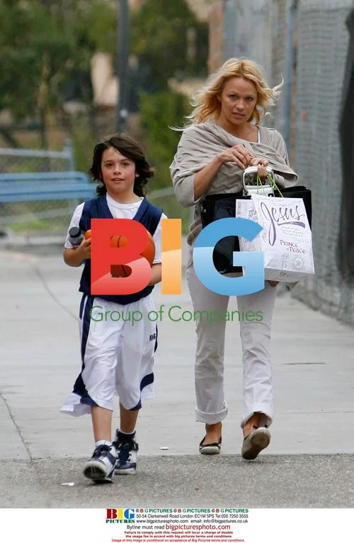 Pamela Anderson and son Brandon Lee at basketball game