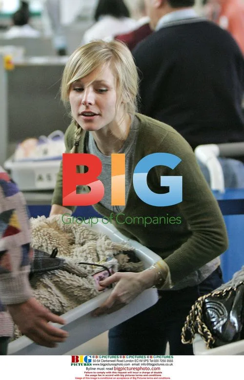 Kristen Bell Departs LAX with Male Friend