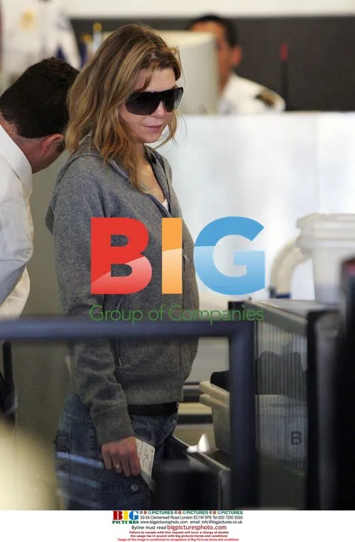 Ellen Pompeo Departs LAX with Husband