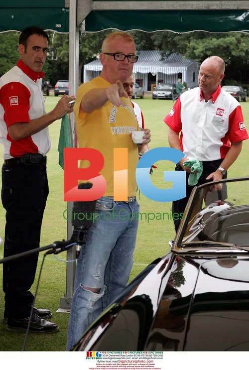 Chris Evans drives vintage Ferrari at Salon Prive