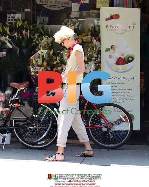 Agyness Deyn smoking on bike in Soho