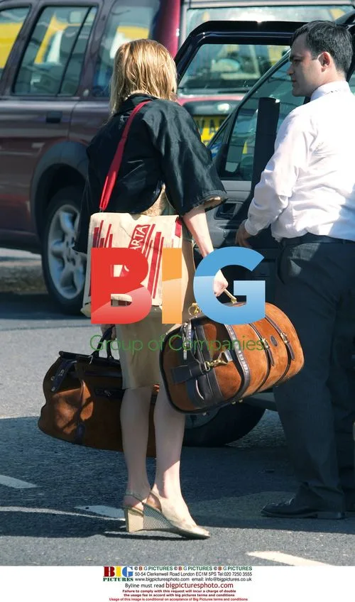 Mystery blonde leaving Jude Law's house