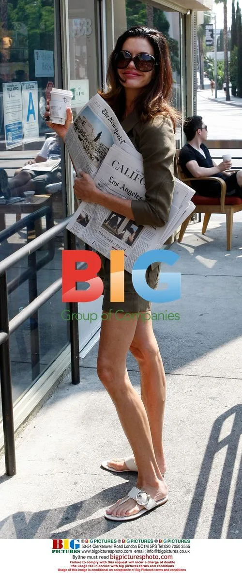 Janice Dickinson grabs coffee, reads newspapers in LA