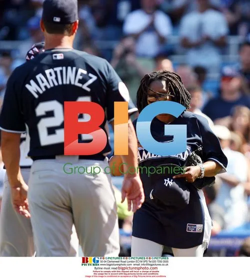 Whoopi Goldberg and Tino Martinez at Charity Softball Game