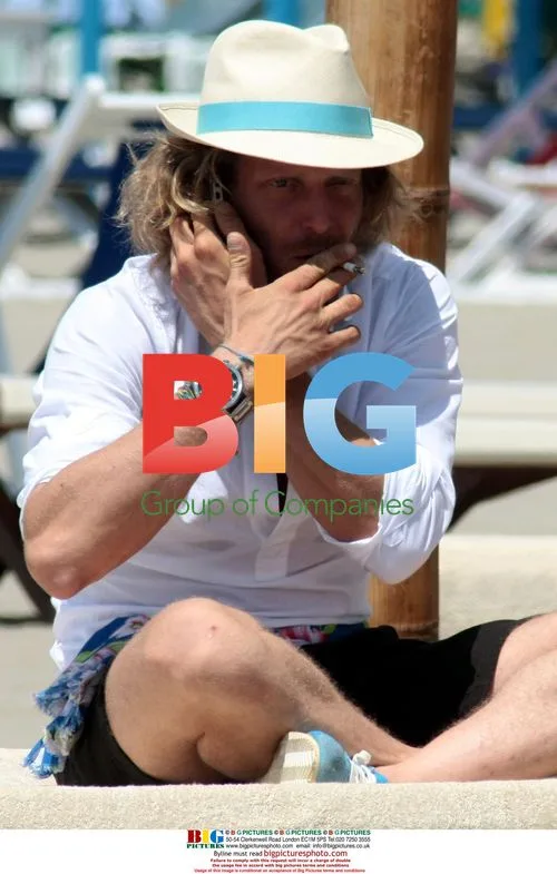 Lapo Elkaan on the beach with friends