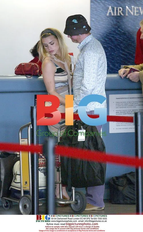 Chris Evans and Billie Piper leave LAX