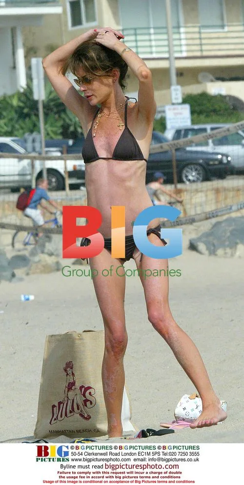 Lara Flynn Boyle Shows Off on the Beach