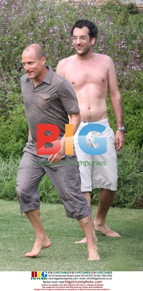 Owen Wilson and Woody Harrelson play football