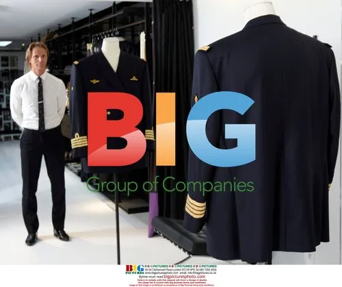 Belgian Designer Stijn Helsen Poses with Prince Laurent's Costume
