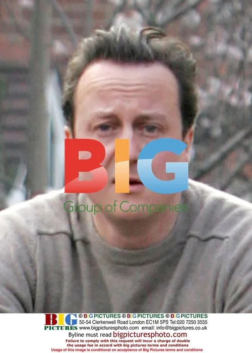David Cameron cycling to work without helmet