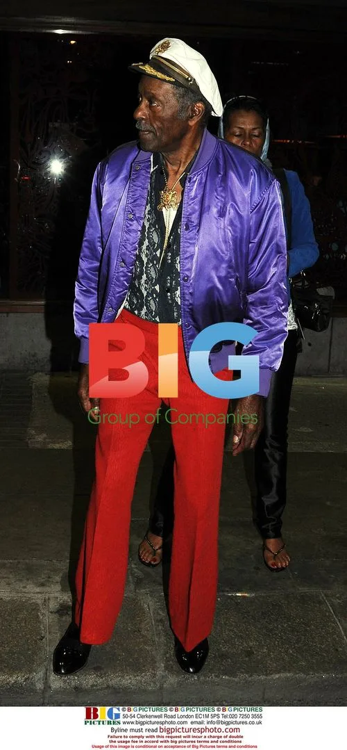 Chuck Berry leaving Dublin restaurant after show