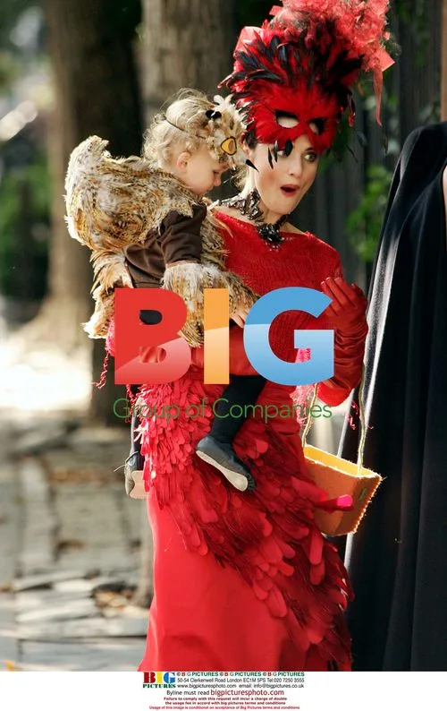 Rachel Weisz in Vibrant Red Costume for Vogue Shoot