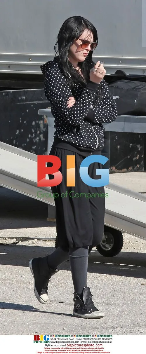 Rumer Willis takes a cigarette break