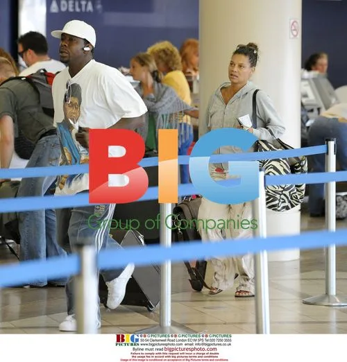 Bobby Brown and Alicia Etheridge at LAX