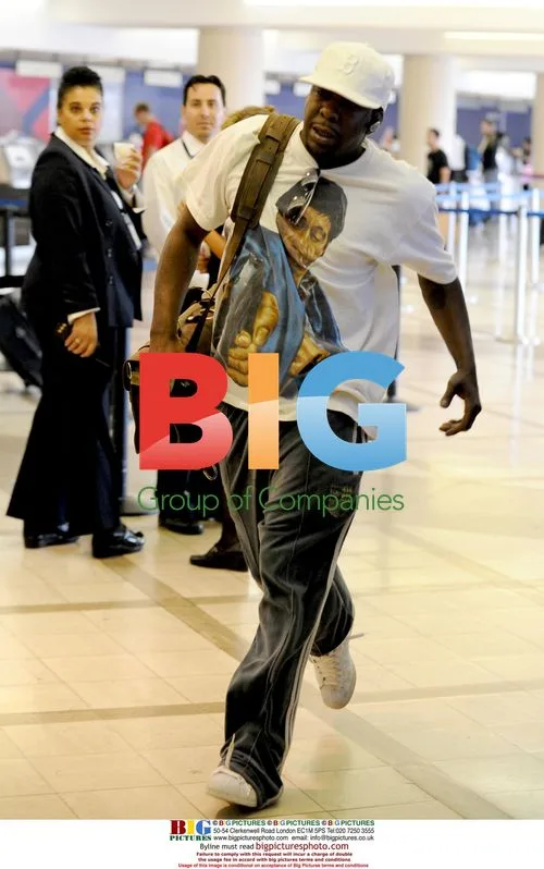 Bobby Brown and girlfriend at LAX