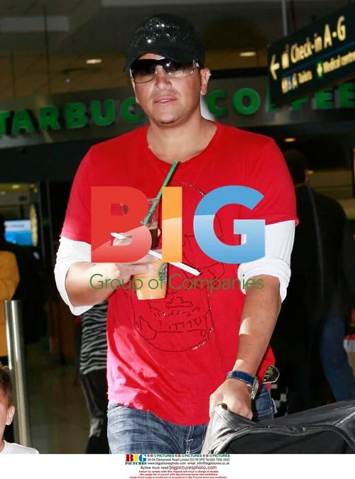 Katie Price, Peter Andre, and children at airport