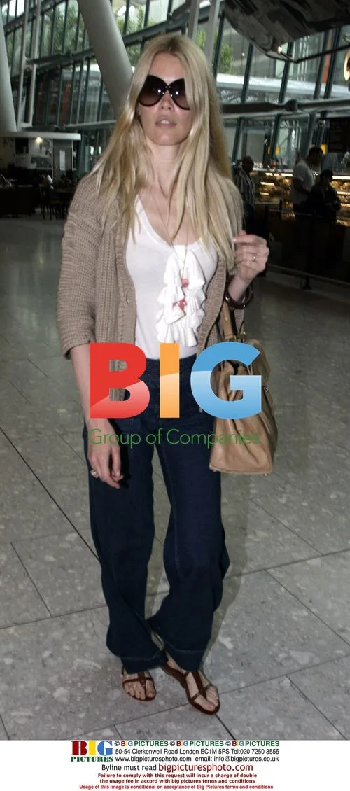 Claudia Schiffer Arrives at Heathrow Airport