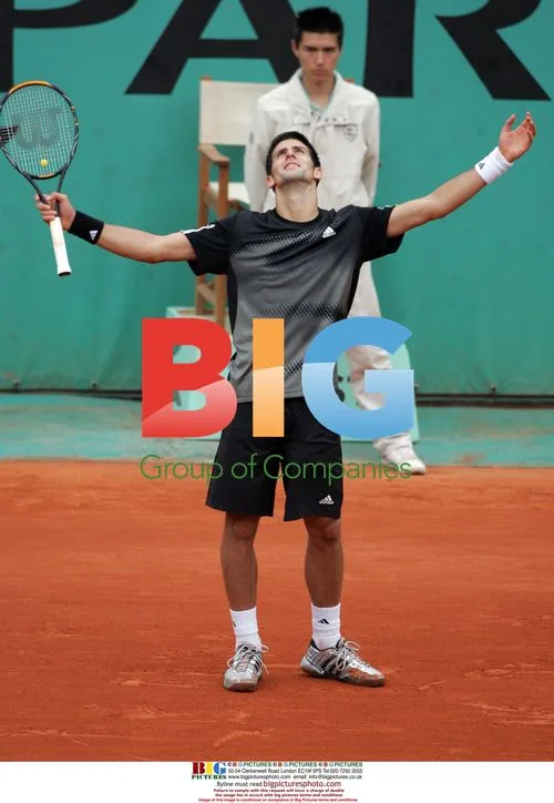 Novak Djokovic celebrates point vs Gulbis