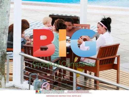 Katie Price with family at hotel pool