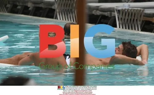 Steve Gerrard and Alex Curran in pool, Miami