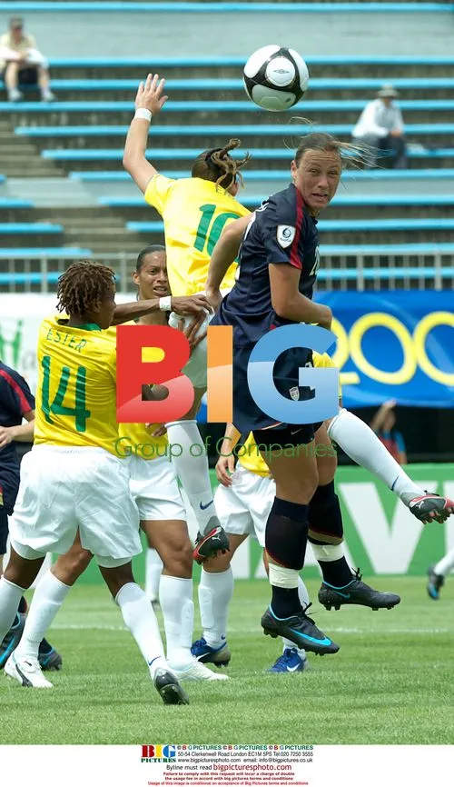 Abby Wambach heads ball in 2008 Peace Queen Cup