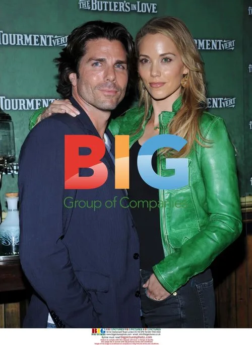 Elizabeth Berkley and Greg Lauren at film premiere