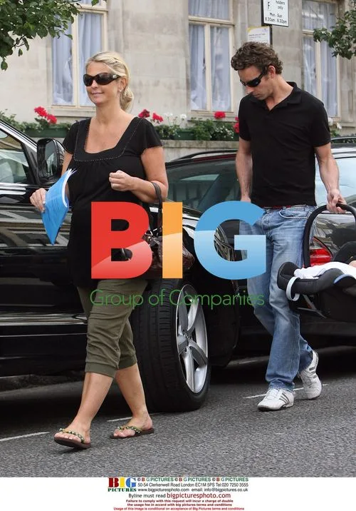 Ulrika Johnson with new baby and husband