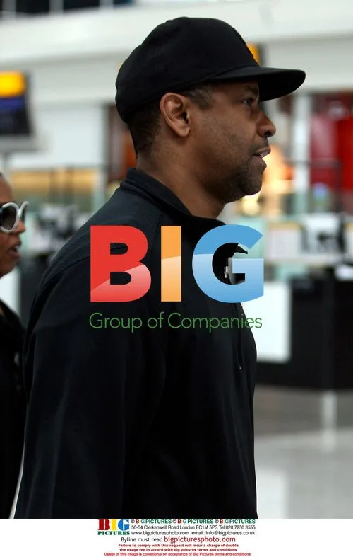 Denzel Washington and wife depart Heathrow