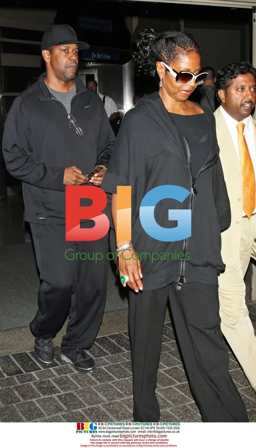 Denzel Washington and wife arrive at LAX