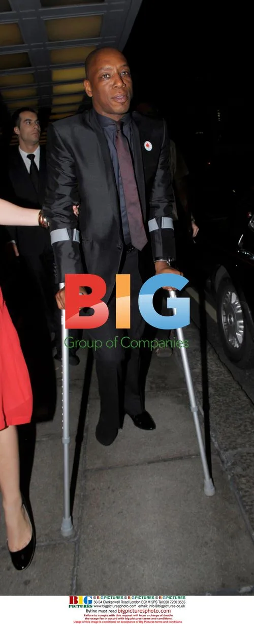 Ian Wright leaves Dorchester Hotel on crutches