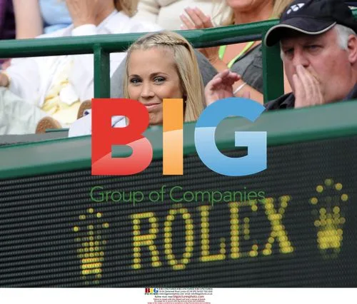 Bec Cartwright watches husband Lleyton Hewitt's Wimbledon match