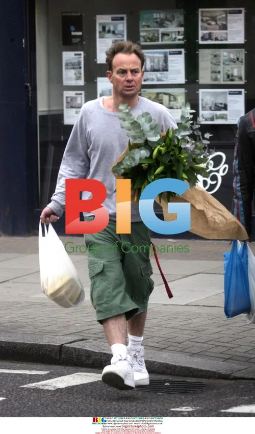 Actor Jason Donovan spotted with flowers and bananas