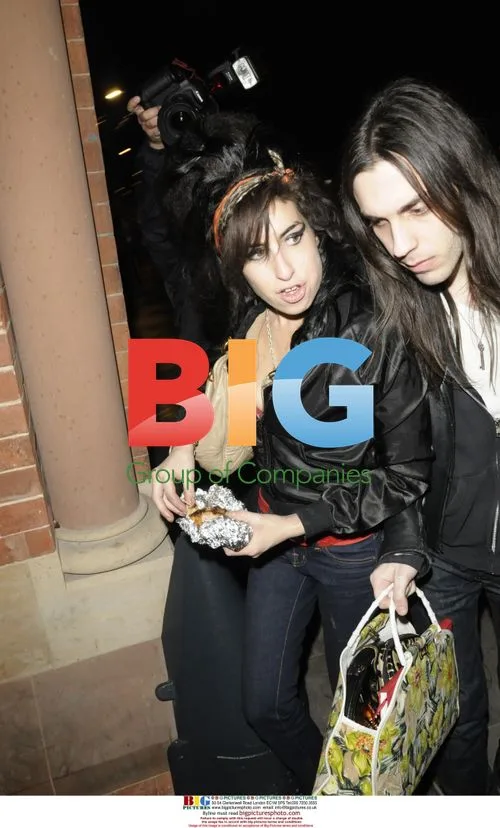 Amy Winehouse leaves for Paris to perform at Fendi party