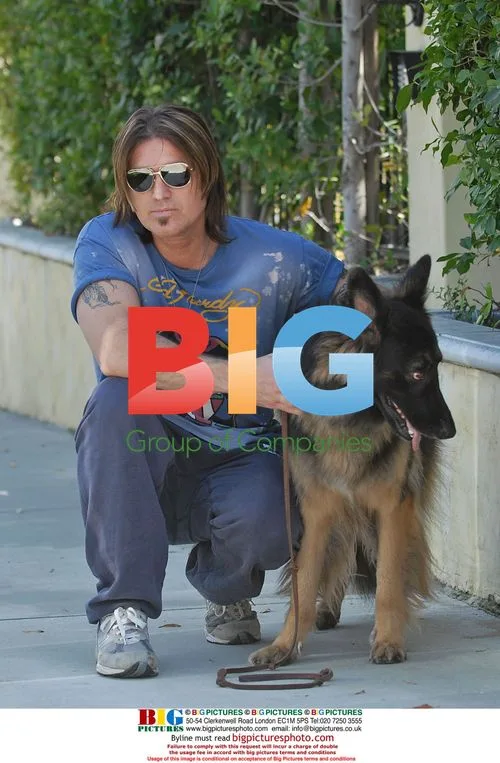 Billy Ray Cyrus takes dog for walk