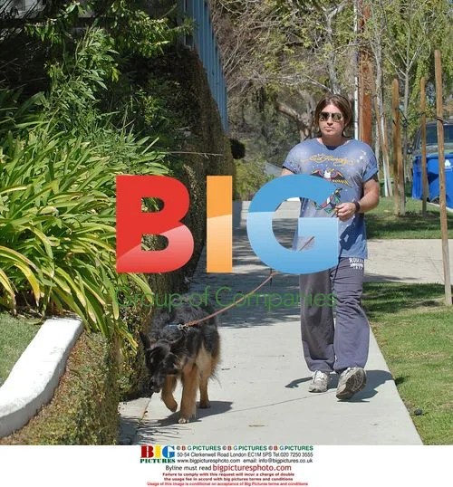 Billy Ray Cyrus takes dog for walk