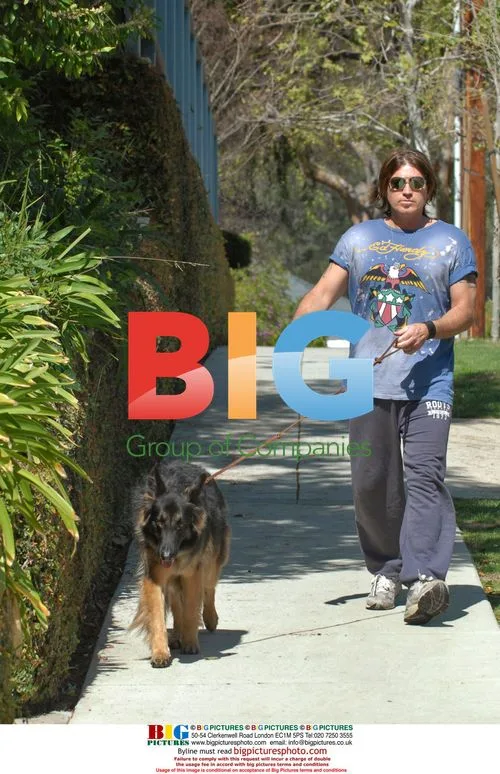 Billy Ray Cyrus takes dog Tex for walk