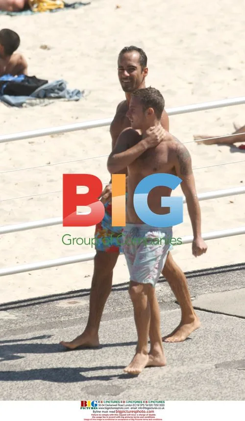 Alex Dimitriadis & friend swim at Bondi Beach