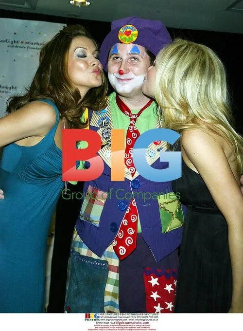 Chrishell Stause and Amanda Baker kiss clown at gala