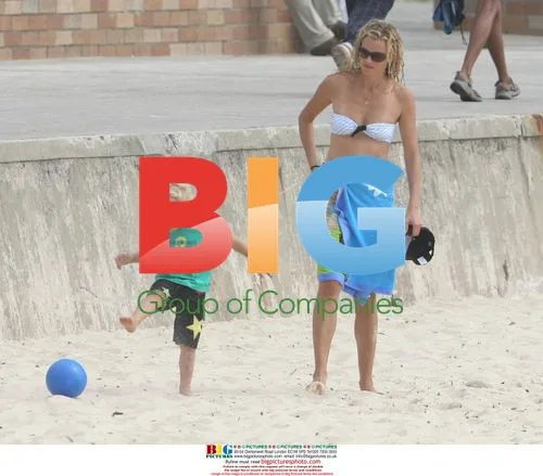 Model Sarah O'Hare and son at Bronte Beach